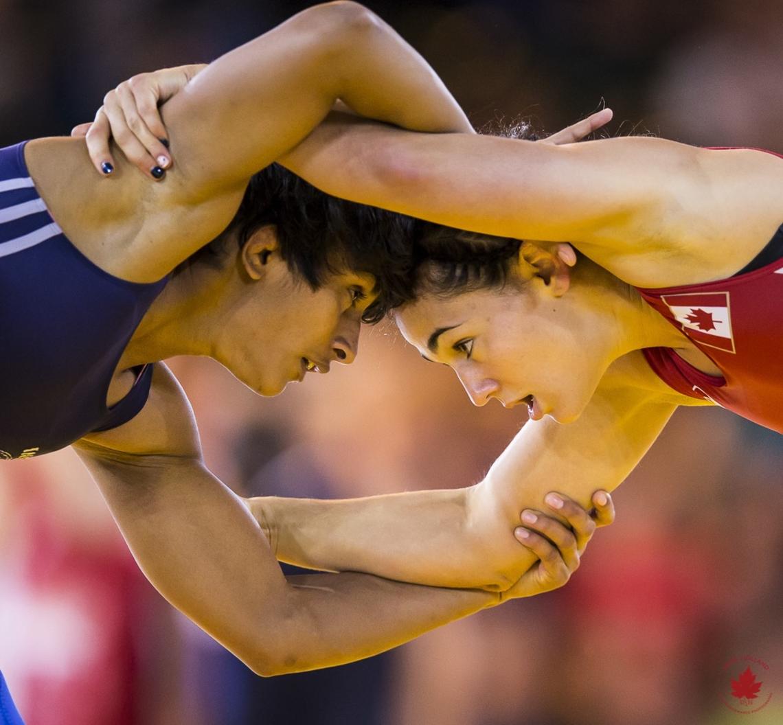 Jasmine Mian, right, is a former Olympic wrestler who participated in Game Plan, an initiative to help elite athletes pursue both their education and sport goals. Photo by 