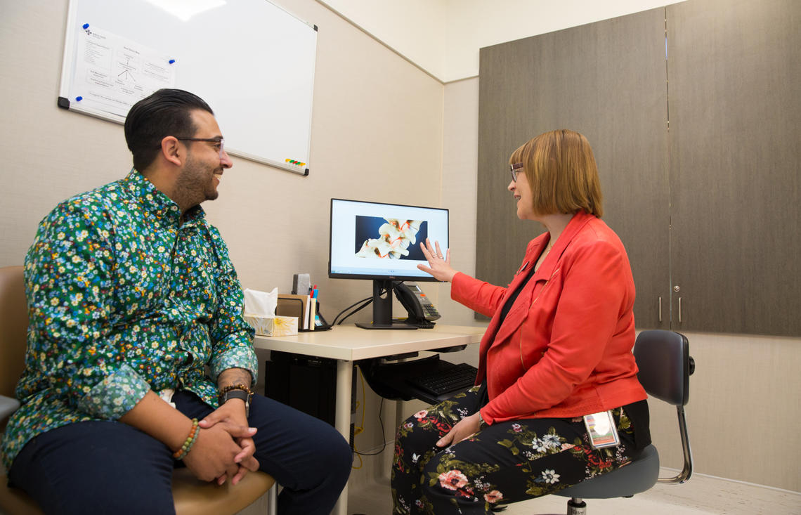 Lori Montgomery consults with patient Shanali (Shan) Rahim about safe opioid tapering.