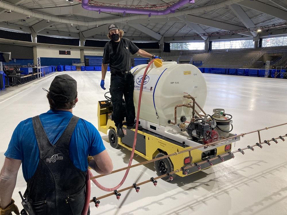 Olympic Oval operations crew painting the ice white with Jet Ice sprayer