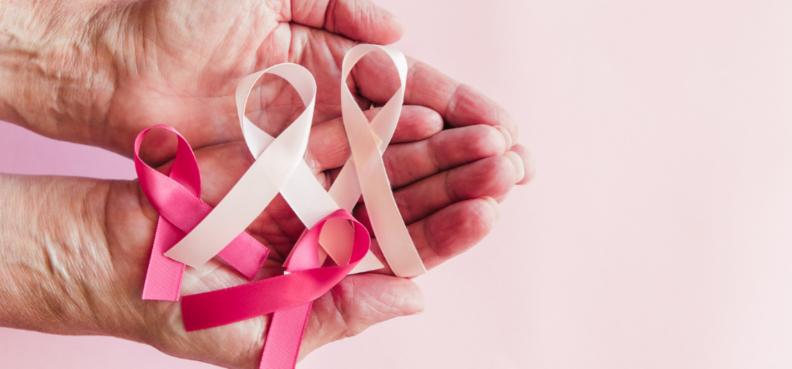 Hands holding oncology ribbons