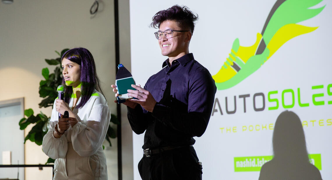 Nasid Islam, left, and Steven Ma present the Autosoles concept to the Liftoff! competition.