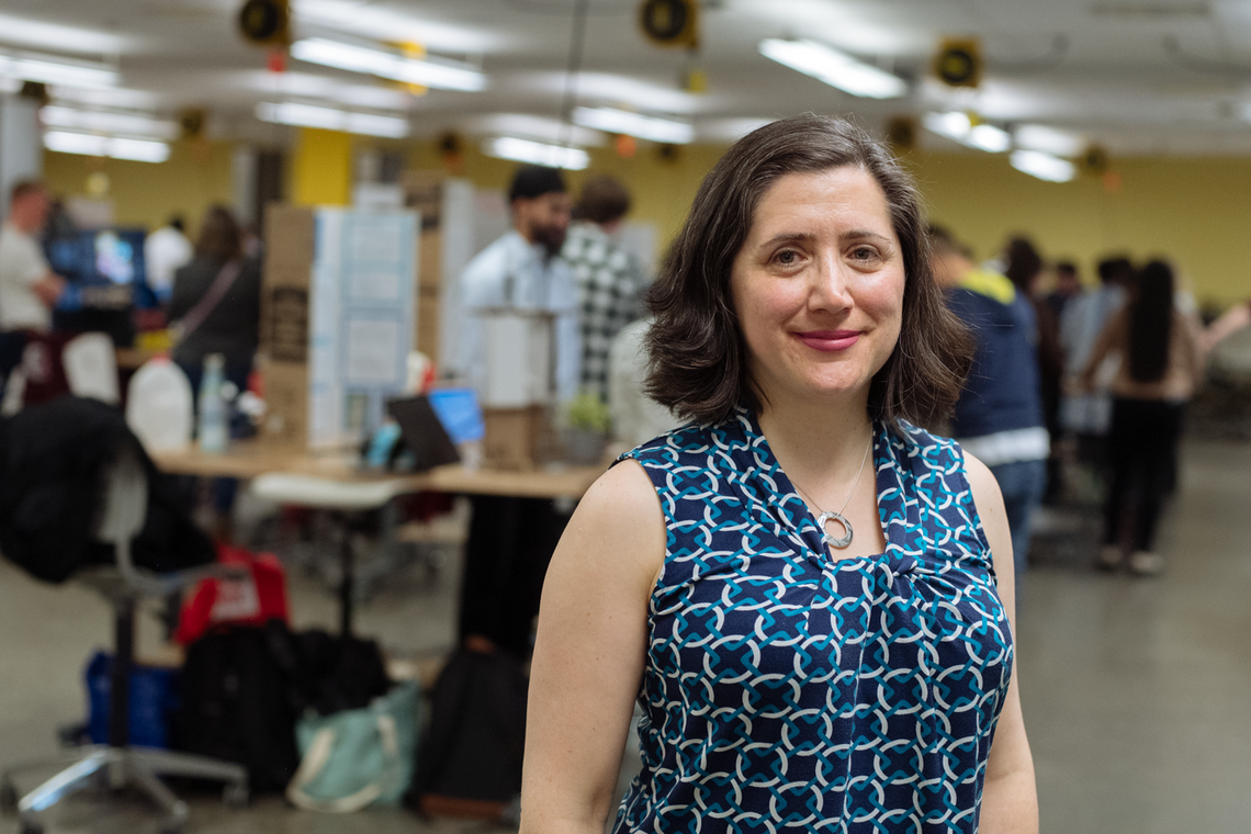 Laleh Behjat stands in her classroom in the Schulich School of Engineering building. Behind her the classroom is abuzz with students demoing their final projects.