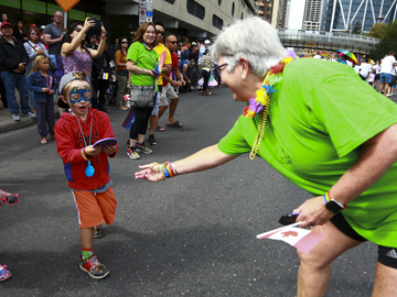 Dr. Dru Marshall showed off the UCalgary spirit while marching through the streets of downtown Calgary in 2017 at the Calgary Pride Parade.