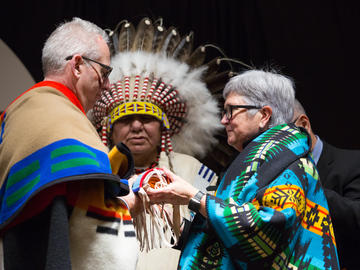 A pipe bag transfer ceremony with President Ed McCauley and Dr. Dru Marshall to mark the two-year anniversary of ii' taa'poh'to'p, UCalgary's Indigenous Strategy.