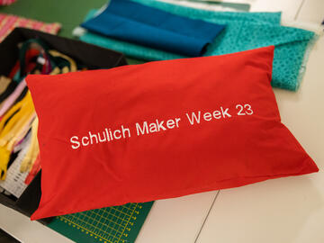Schulich Maker Week embroidered on a pillow
