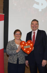 Diane Kenyon, vice-president (university relations) and United Way campaign executive sponsor and Richard Sigurdson, Faculty of Arts dean and United Way campaign co-chair celebrate the record-breaking total of funds raised this year to support the community.