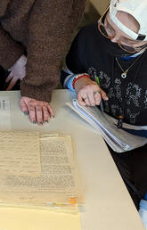 Students peruse archives in Block Week Course