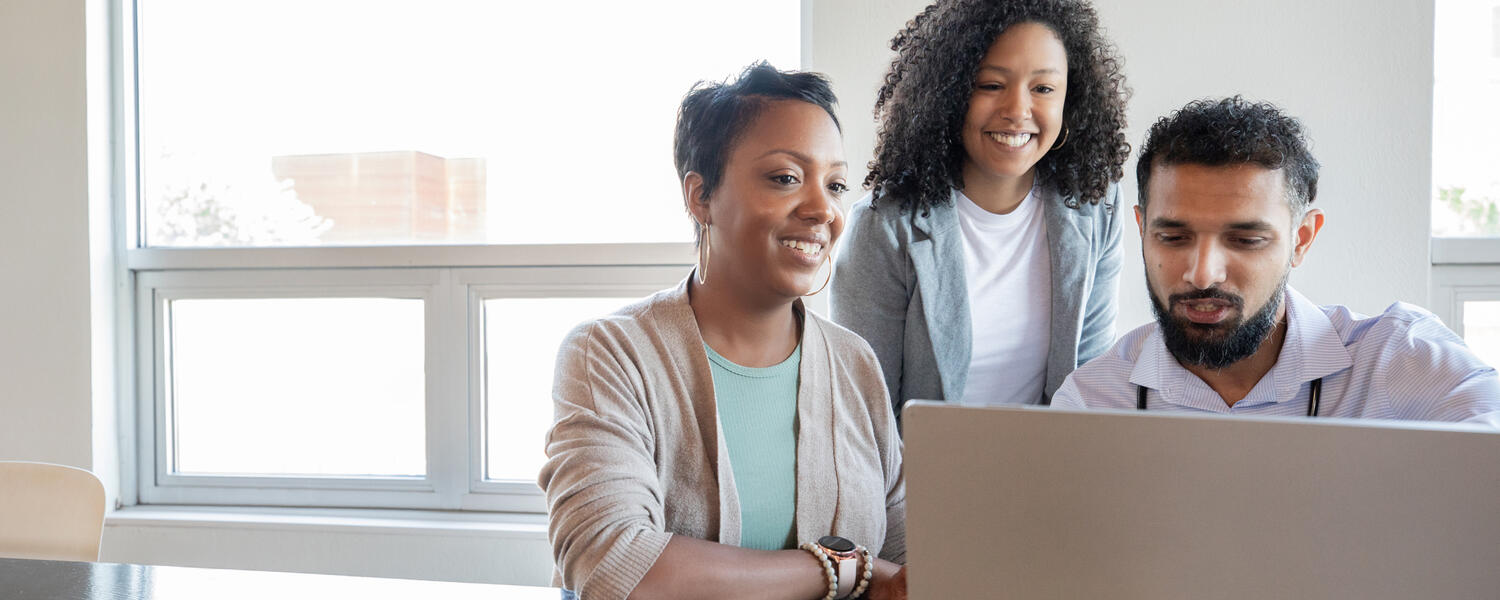 Doctor of Nursing, three students working at a computer