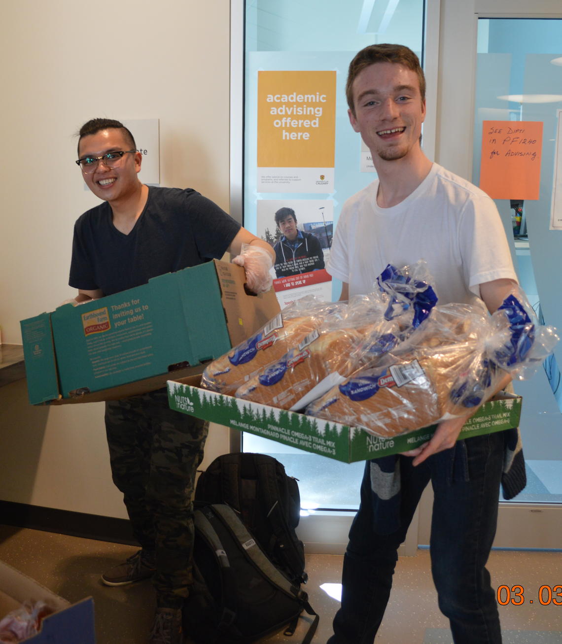 YO students make sandwiches in the PF Foyer. 