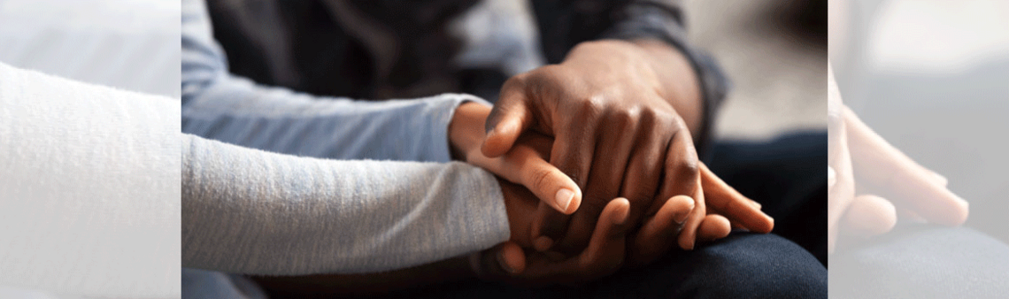 Three hands intertwined, holding eachother