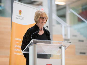 Nursing dean (at the time) Dianne Tapp, MN’93, PhD’97, welcomes graduands and their families and friends at the pinning ceremony.