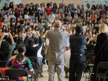 Proud parents and family members take photos of their graduating students at the pinning ceremony.