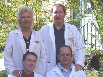 Our NP faculty members Karen Then and Jim Rankin with two of our graduates. Our graduate programs begin in the '80s with the Master of Nursing in 1981 and build momentum into the '90s with the establishment of our doctoral program. In 2001, our Nurse Practitioner diploma program receives approval. 