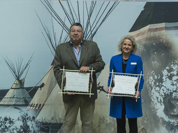 Dr. Manyfingers and Dr. Davidson are presented with gifts after the ceremony to mark the partnership.