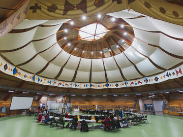 Guests inside the Siksika Piiksapi Memorial Arbor before start of event.