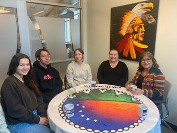 Nursing students with Elder Evelyn Good Striker at Elders on Campus