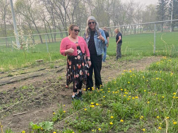 Darcy Calihooo and Michelle Scott at community garden plot.