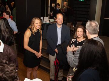 Student with family members laughing. 