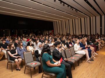 Students and family and friends seated in MacEwan Ballroom prior to event. 