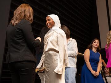 Students cross Pinning Ceremony stage