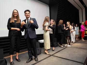 Students cross Pinning Ceremony stage