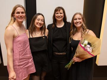 Four women smiling