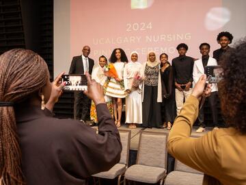 Pinning Ceremony crowd taking photos