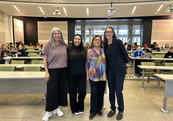 Four women in lecture room