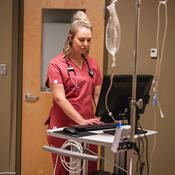 Nurse in front of computer terminal