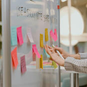 Colourful sticky notes on board