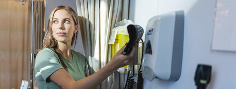 Nurse looking off in distance in clinical room
