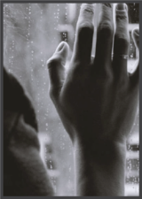 Image of a hand on a window